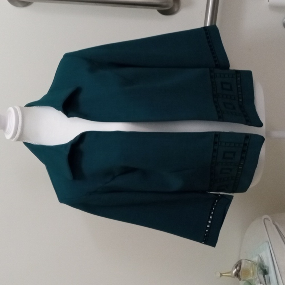 K Studio Collection 10 open jacket with cut outs on the sleeves and hem.  NWOT